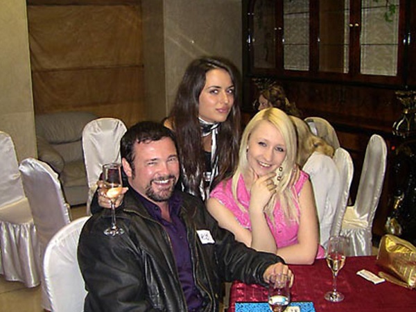 A photo of a foreign man with beautiful women from Kiev Ukraine