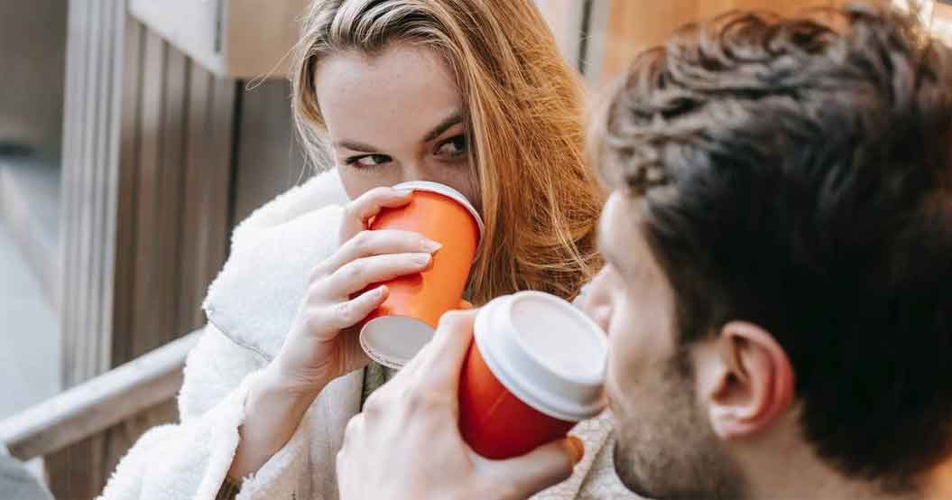 A man and a woman drinking.