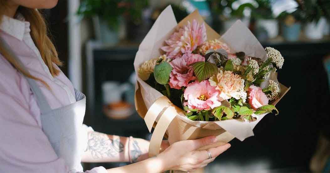 A woman holding a bouquet.